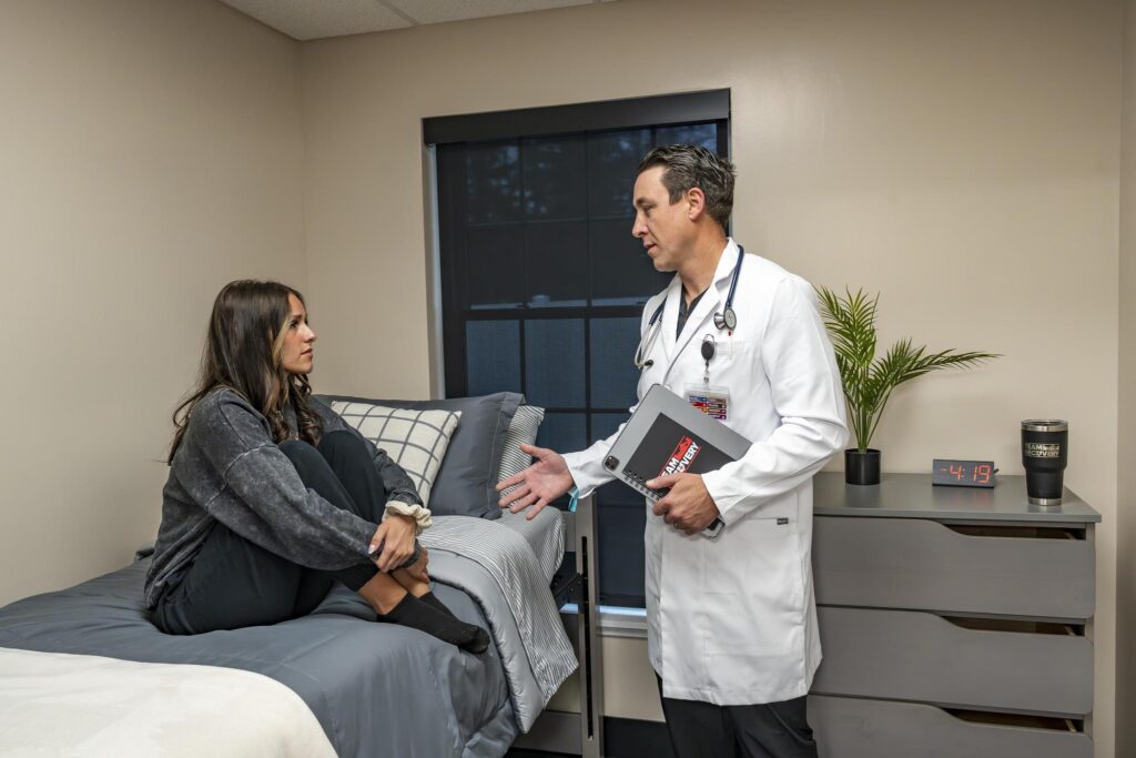 Medical provider speaking with a client during medication-assisted treatment at Team Recovery in Toledo, Ohio.